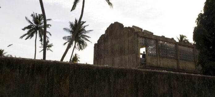 A 2007 photograph of a standing in a from a damaged, roofless structure in Sri Lanka's Jaffna district, which saw some of the most brutal fighting during the civil war.